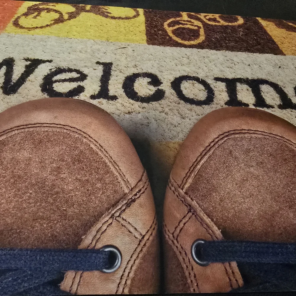 Brown Welcome Mat with Shoe Design